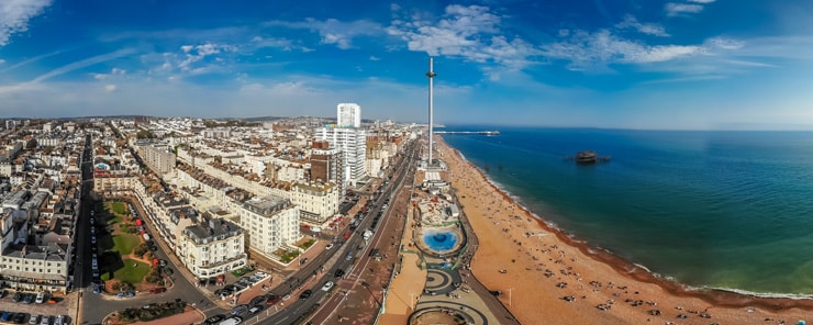A panoramic aerial photograph of the Brighton seafront