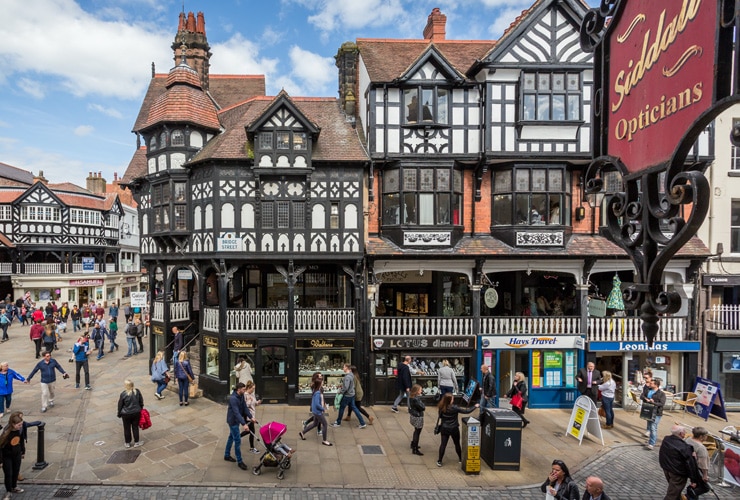 Black and white timber-framed buildings in Chester city centre.