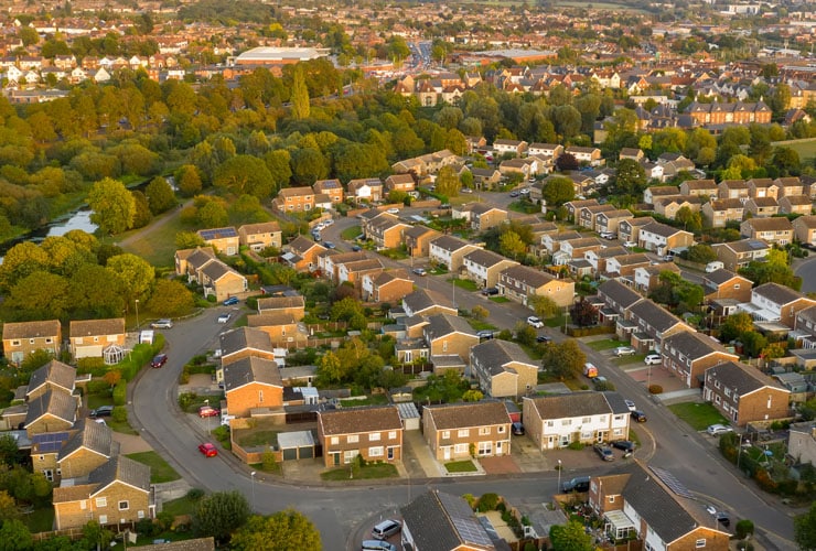 Aerial view of riverside suburban residential streets in Colchester, Essex