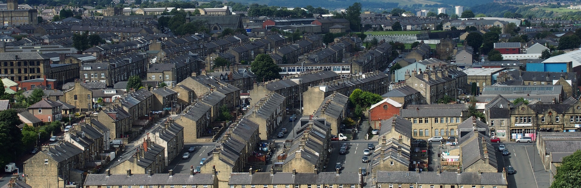 Aerial view of Halifax in West Yorkshire, showing residential streets and terraced houses with hills in the background