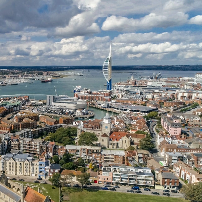 Aerial photograph of Portsmouth on the Hampshire coast, showing the dense island city and its waterfront.
