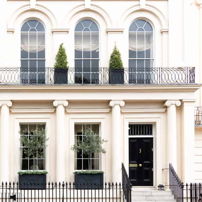 White stucco-fronted mansion apartment building in Kensington