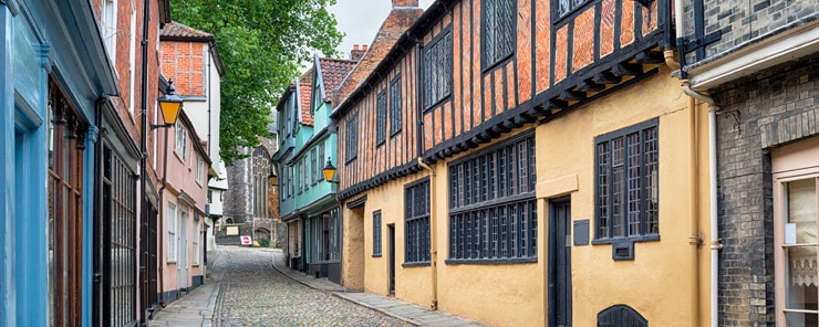 Colourful Tudor half-timbered houses on a historic street in Norwich