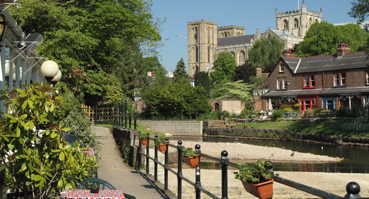 A footpath along the River Skell in Ripon on a summer's day