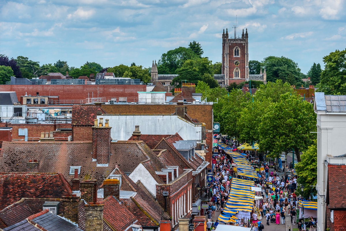 St Peter's Street and St Peter's Church seen from the Clock Tower on a market day in St Albans, Hertfordshire