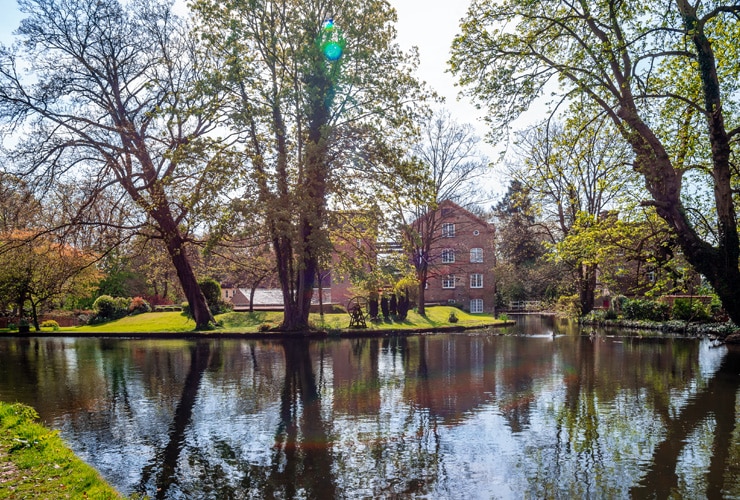 The Old Mill House at Grove Mill, Cassiobury Park, seen through trees over water