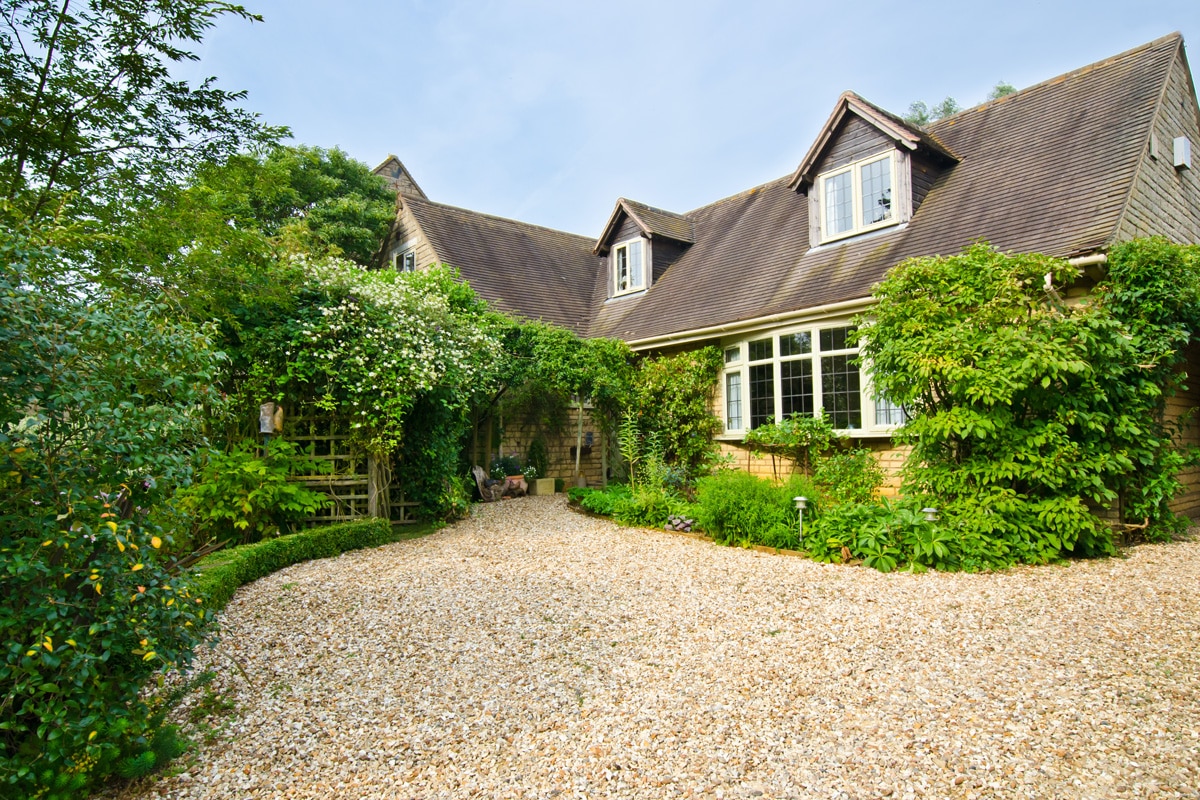 Gravel Driveway An English cottage with a gravel driveway.