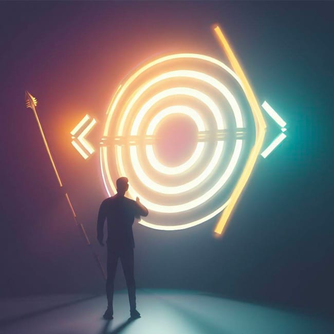 Illustration of a man standing next to a neon structure that looks like a dartboard. Image represents setting goals.