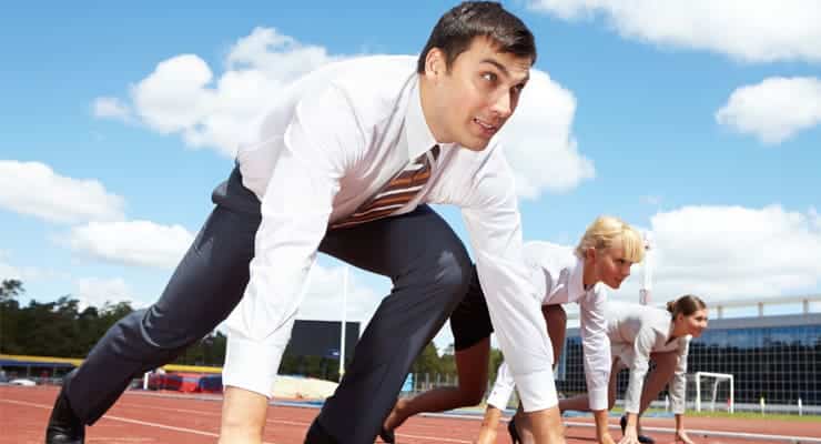 picture of business men and woman on the starting line of a race