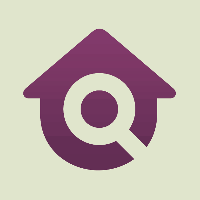 A simple icon that combines the image of a magnifying glass and the image of a house.