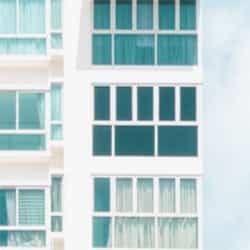 Windows on the outside of a new-build apartment block.