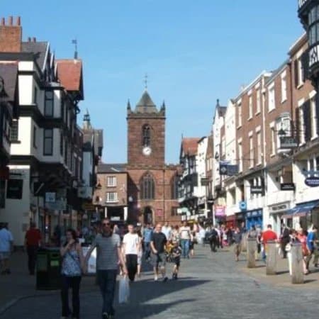 A busy shopping street in Chester's city centre.