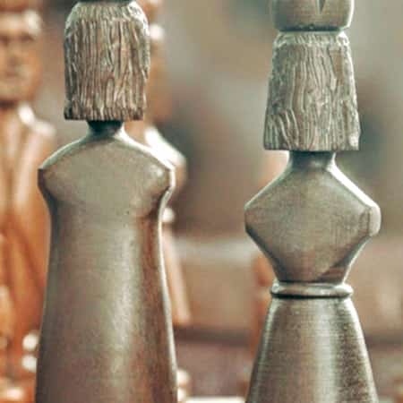 Two finely carved chess pieces.