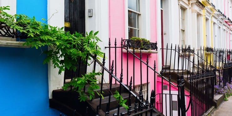 A photograph of brightly coloured terraced houses in Notting Hill, London