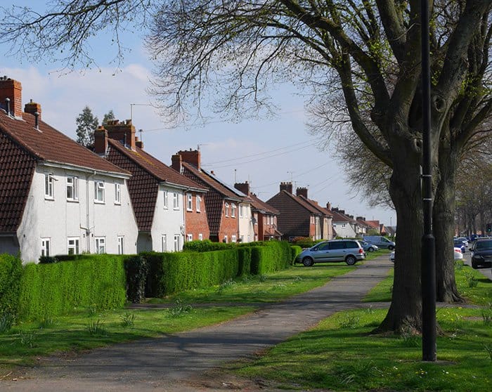 Photograph of a street of typical 1920s council houses, UK