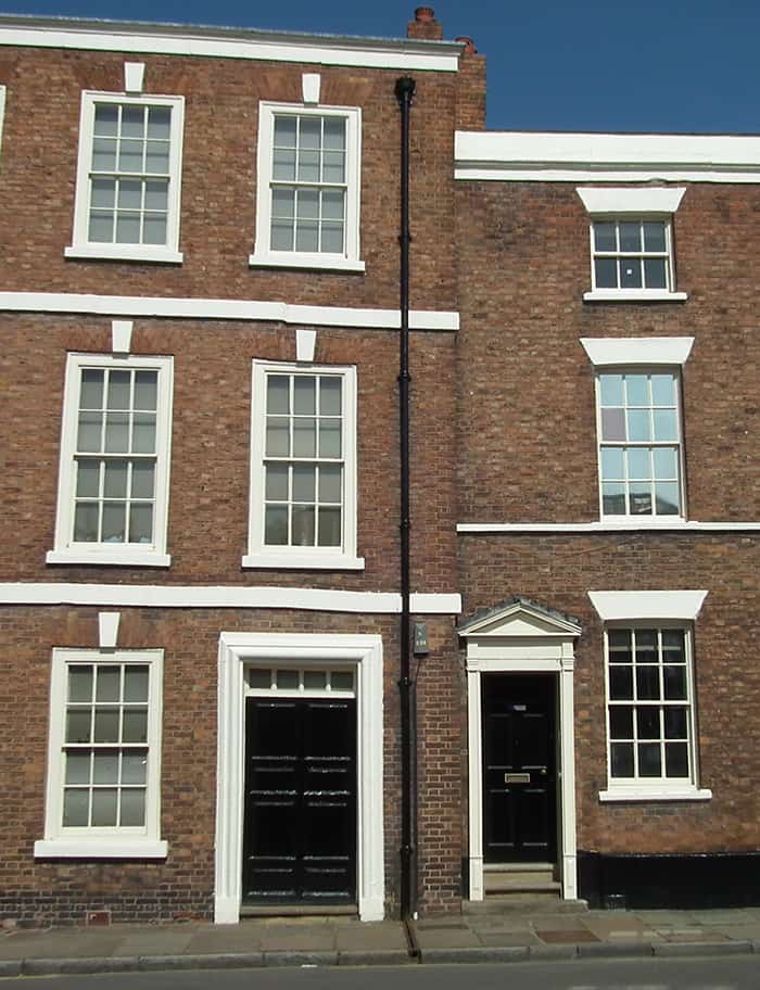 A photograph of a late 17th century terraced house sitting next to a lat 18th century terraced house