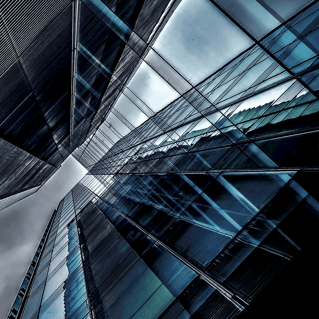 An upward-taken photograph of a glass skyscraper, commercial property.