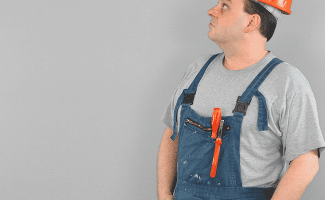 An image of a tradesman, worker wearing a hardhat. Text says, 'Snagging'.