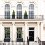 Luxurious apartment house with a white facade, Kensington, London.