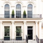 Luxurious apartment house with a white facade, Kensington, London.