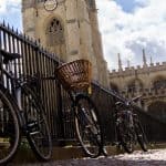 Bicycles fastened to a gate outside Oxford University.