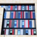 Colourful windows on a tower block that is part of Bradford College.