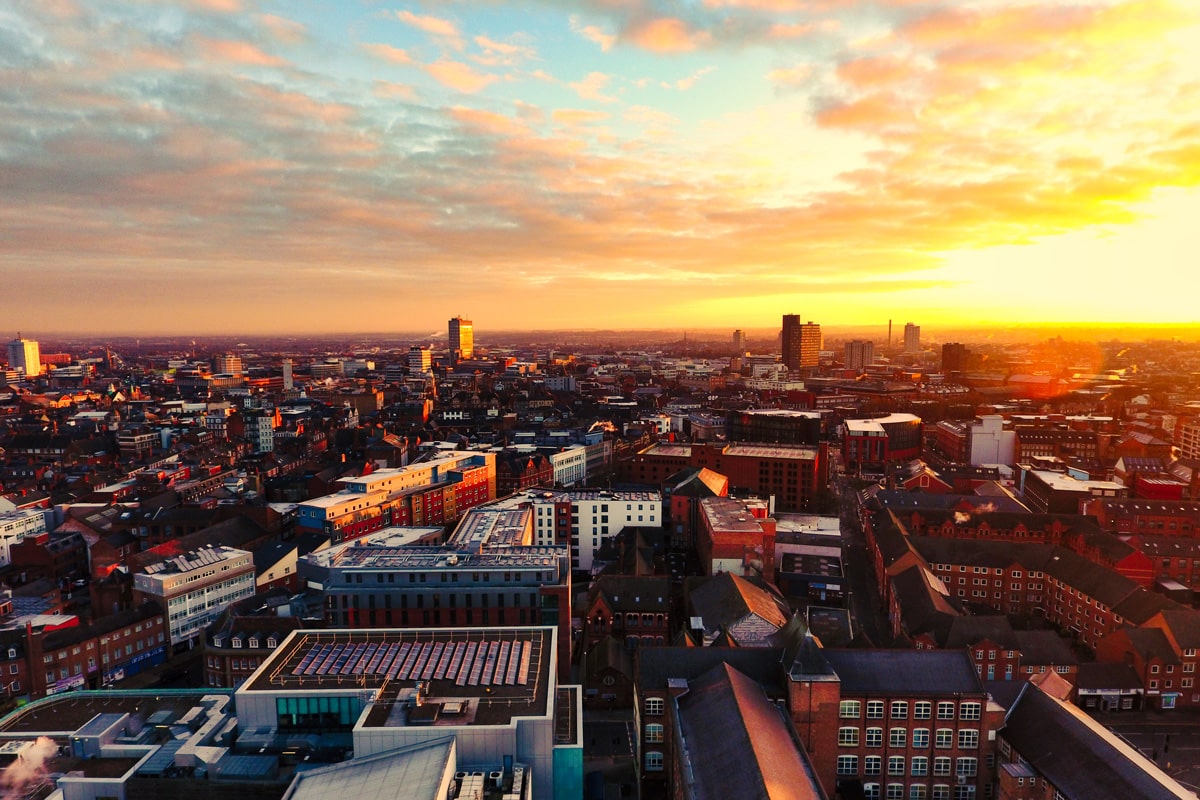 An elevated view of the city of Leicester during sunrise.