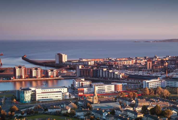 Aerial vide of the centre of Swansea, with the coast.