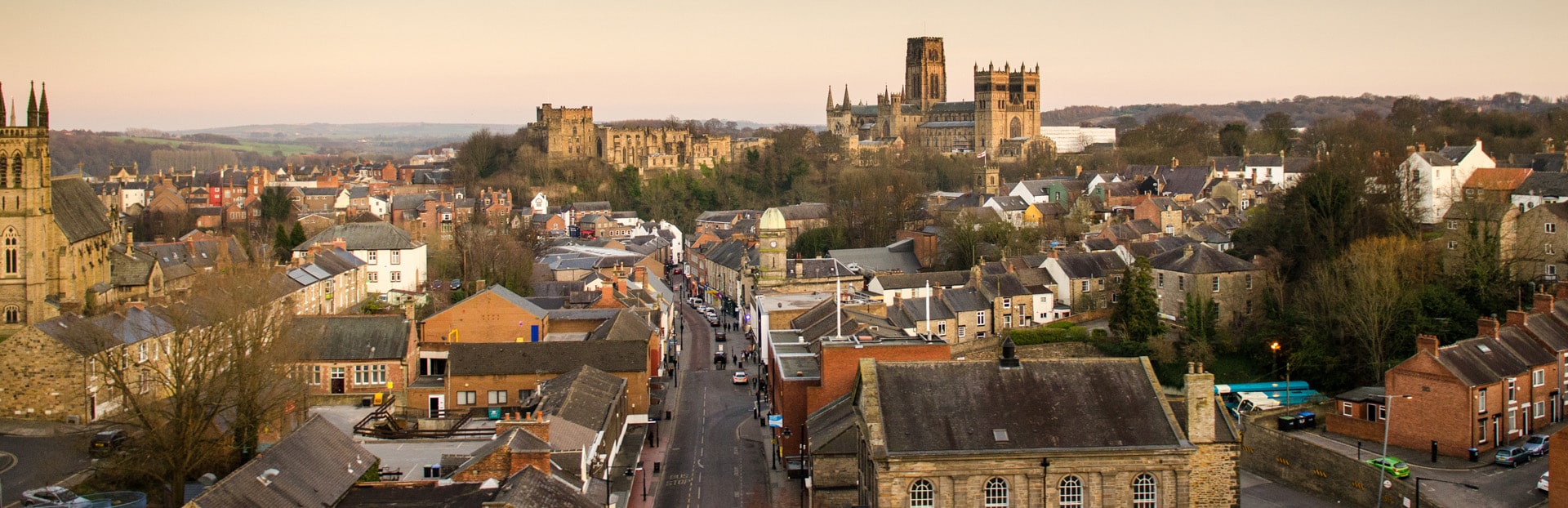 A view of the city of Durham, including the castle and cathedral. Photograph taken from the railway viaduct at sunset.
