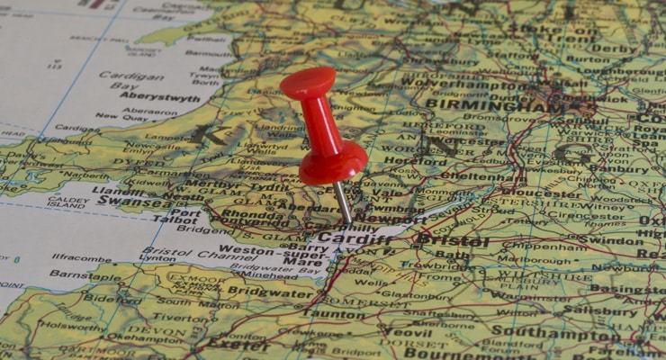 A red pushpin on a map of the UK. Pin pushed into Newport