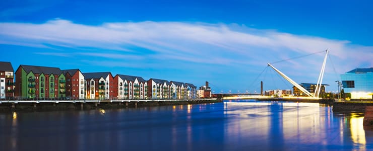 Newport's riverfront along the river Usk with the Millennium footbridge in the background