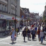 Shoppers walk on St. Peter's Street in Derby.