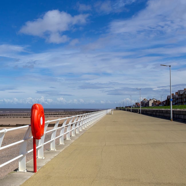 A deserted seafront promenade in Rhyl.