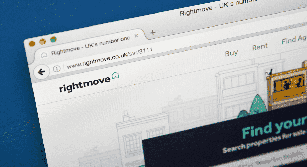 A photgraph of a laptop screen showing the homepage of Rightmove