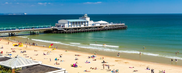 Bournemouth Beechon a summer day - features Bournemouth Pier