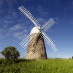 The Halnaker Windmill, near Chichester. The windmill is set against a clear blue sky.