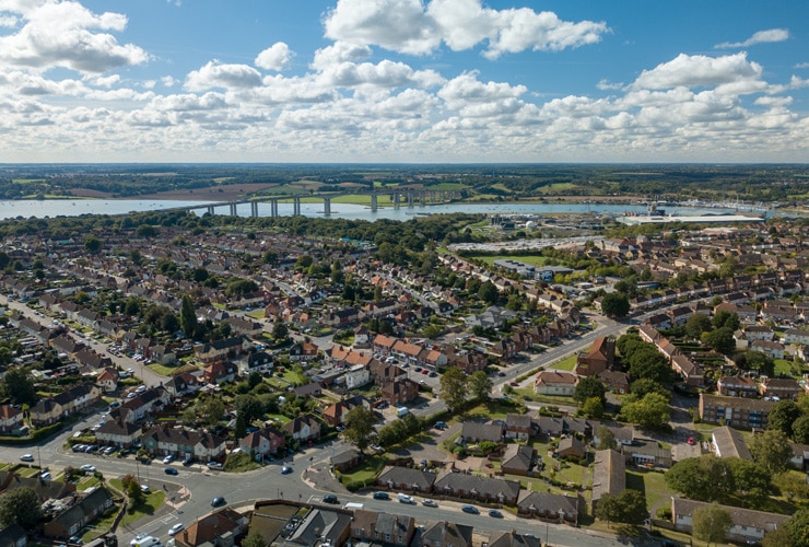 An aerial view of Ipswich on a summer day. Clouds in the sky and the bridge and river in the background