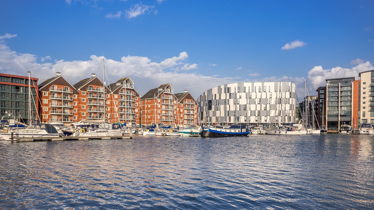 Modern flats on a waterfront on a summer day. Photograph taken at Ipswich Marina in Ipswich UK