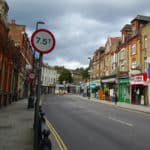 A deserted shopping street in North London.