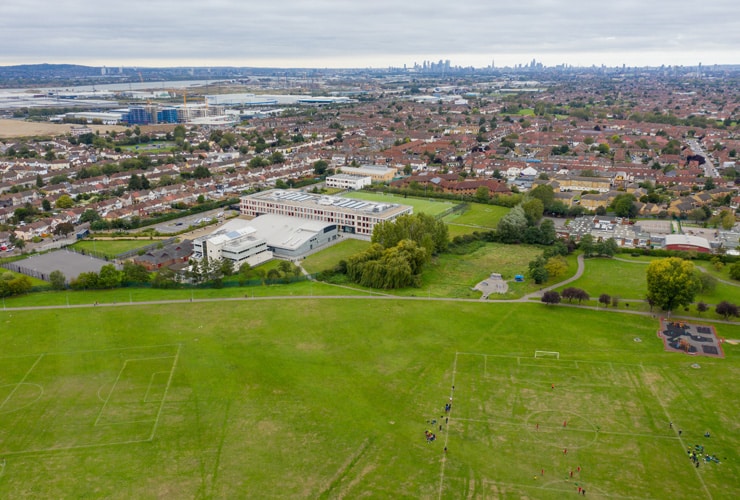 Aerial photo of the town of Dagenham, a district and suburban town in East London, England showing a typical British housing estate and neighbourhood from above.