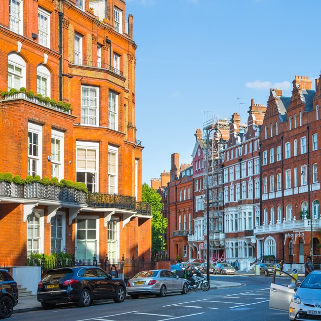 The residential area of Kensington and Chelsea. A photograph of a a row of periodic buildings in Cadogan gate. Image shows luxury property in the centre of London.