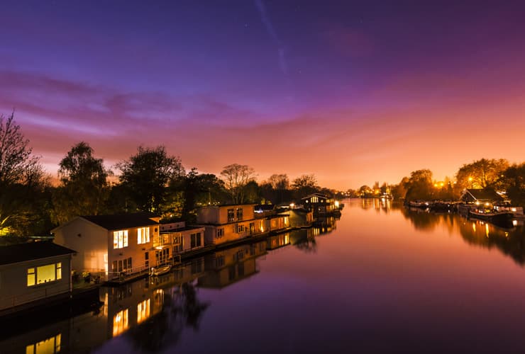 Flating houses on the Thames river at sunset. Photograph taken at Kingston-upon-Thames.