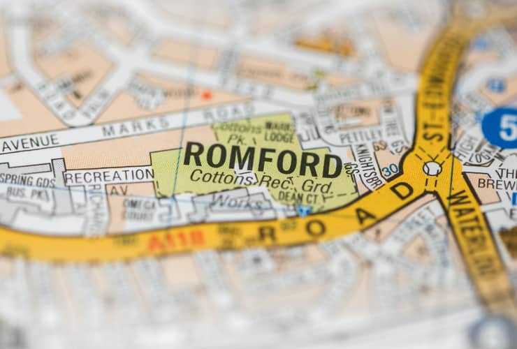 A macro view of a detailed London road map with Romford in the middle.