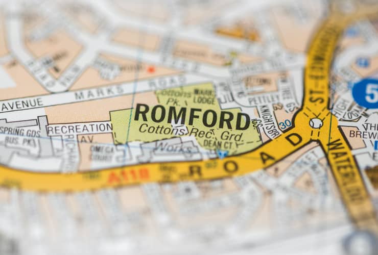 A macro view of a detailed London road map with Romford in the middle.