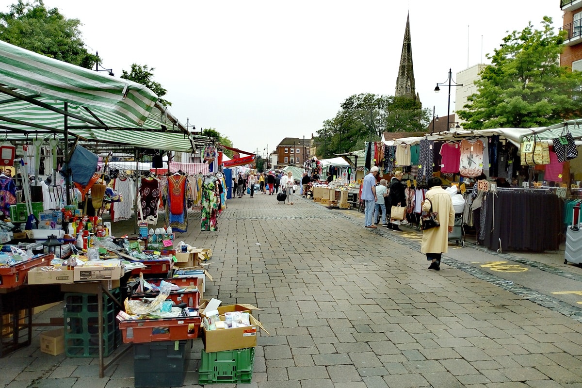 A busy outdoor market. Photograph taken at the historic Romford Market.