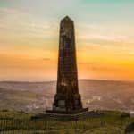 The Saddleworth War Memorial at sunset.