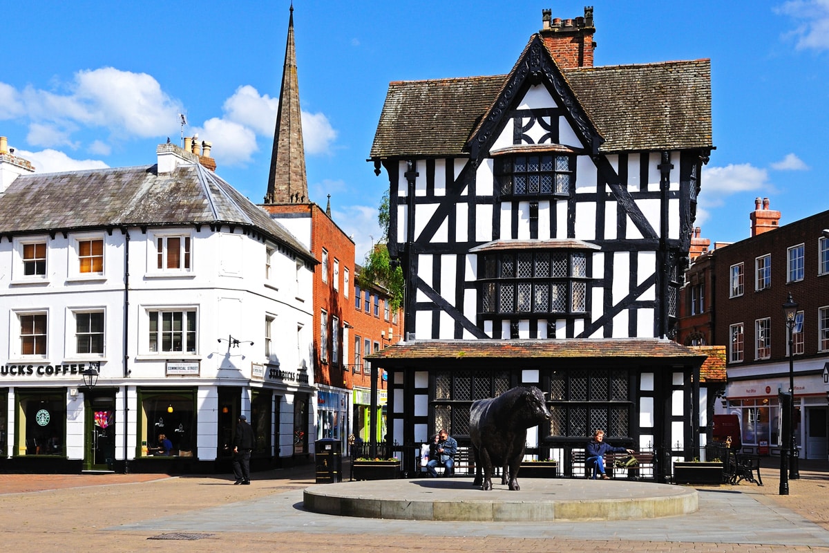 A black and white, timber house. The High House in High Town was built in 1621, Hereford.