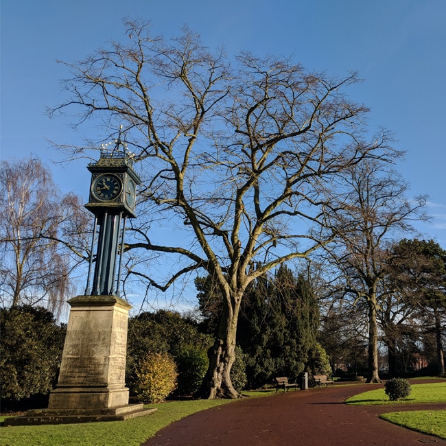 A small clocktower and a leafless tree in West Park, Wolverhampton.
