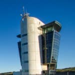 The shipping control building on Aberdeen Pier, against a bright blue sky.