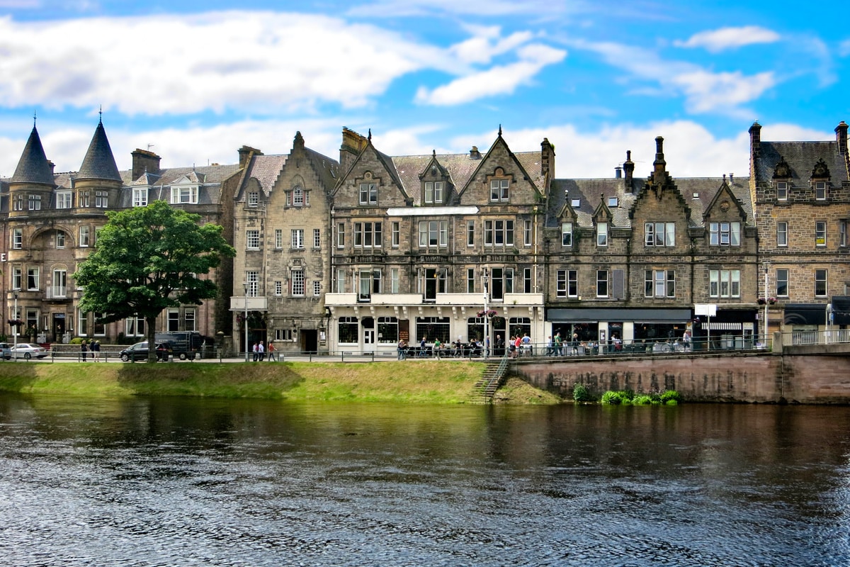 Victorian houses and shop fronts along the banks of the river Ness in Inverness.